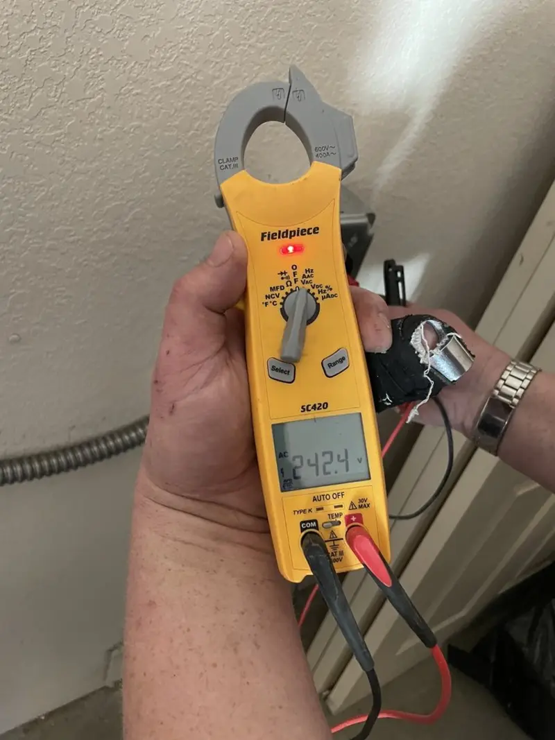 Voltage testing with clamp meter during Generator Installation in Country Club Hills